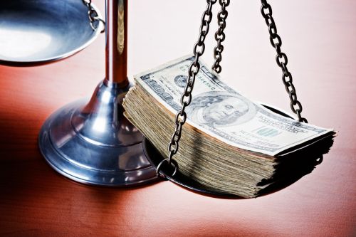 Scales of Justice weighing cash