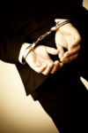 Businessman Handcuffed for Tax Penalities