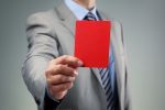IRS Agent Showing Red Card for Willful Violation of FBAR Reporting Requirements