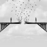 Woman and Man Facing Each Other Across Gap in Broken Bridge