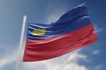 Liechtenstein flag is waving at a beautiful and peaceful sky in day time while sun is shining.